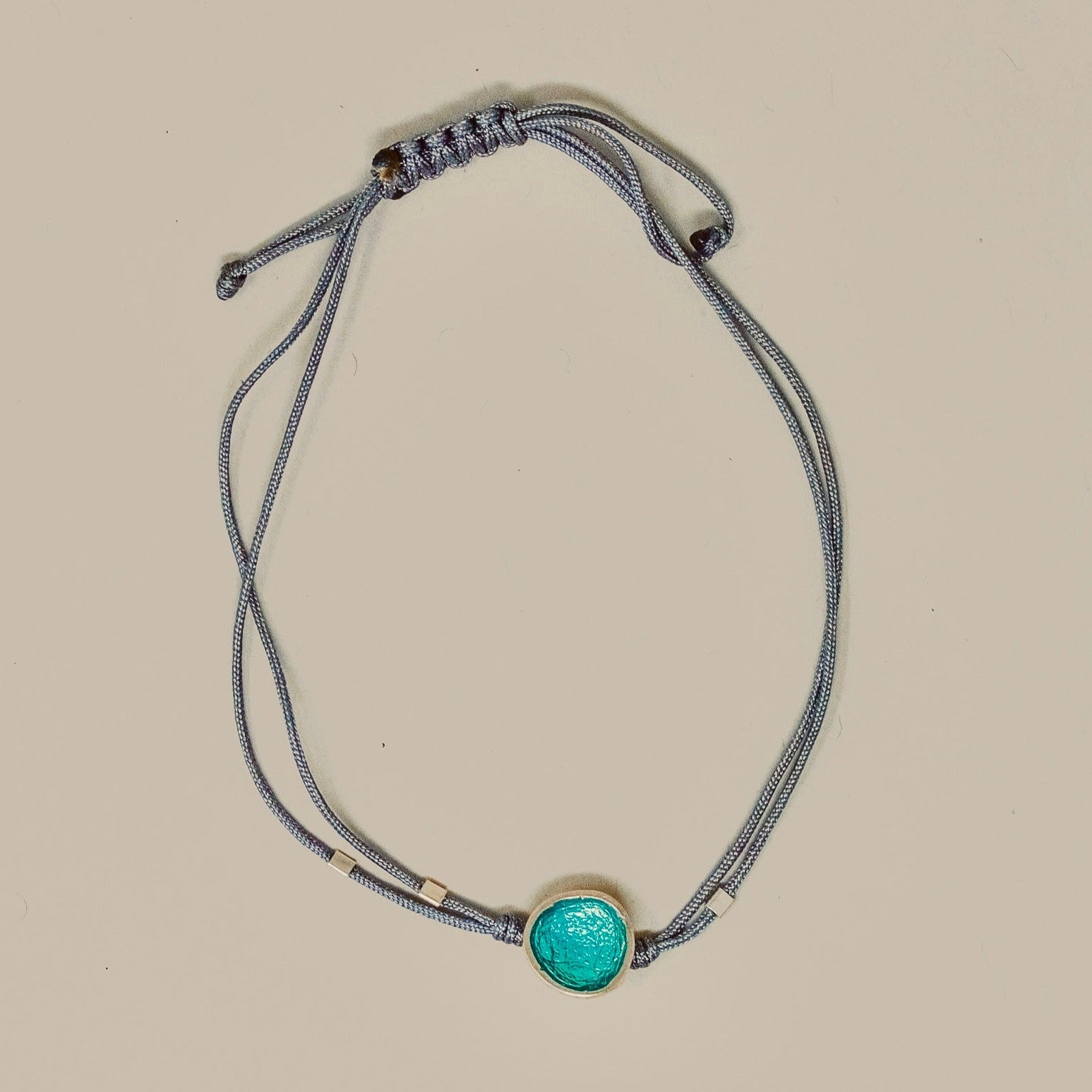 ADJUSTABLE DISC BRACELET